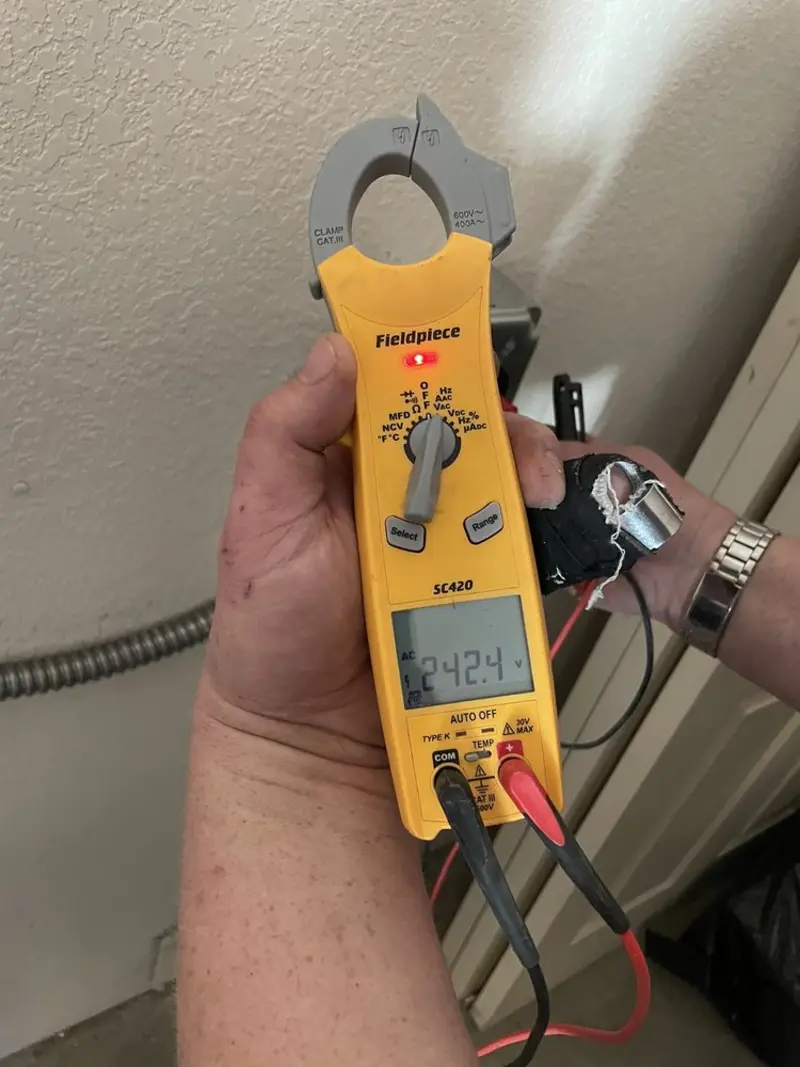 Voltage testing with clamp meter during Circuit Breaker Repair in Hutchinson